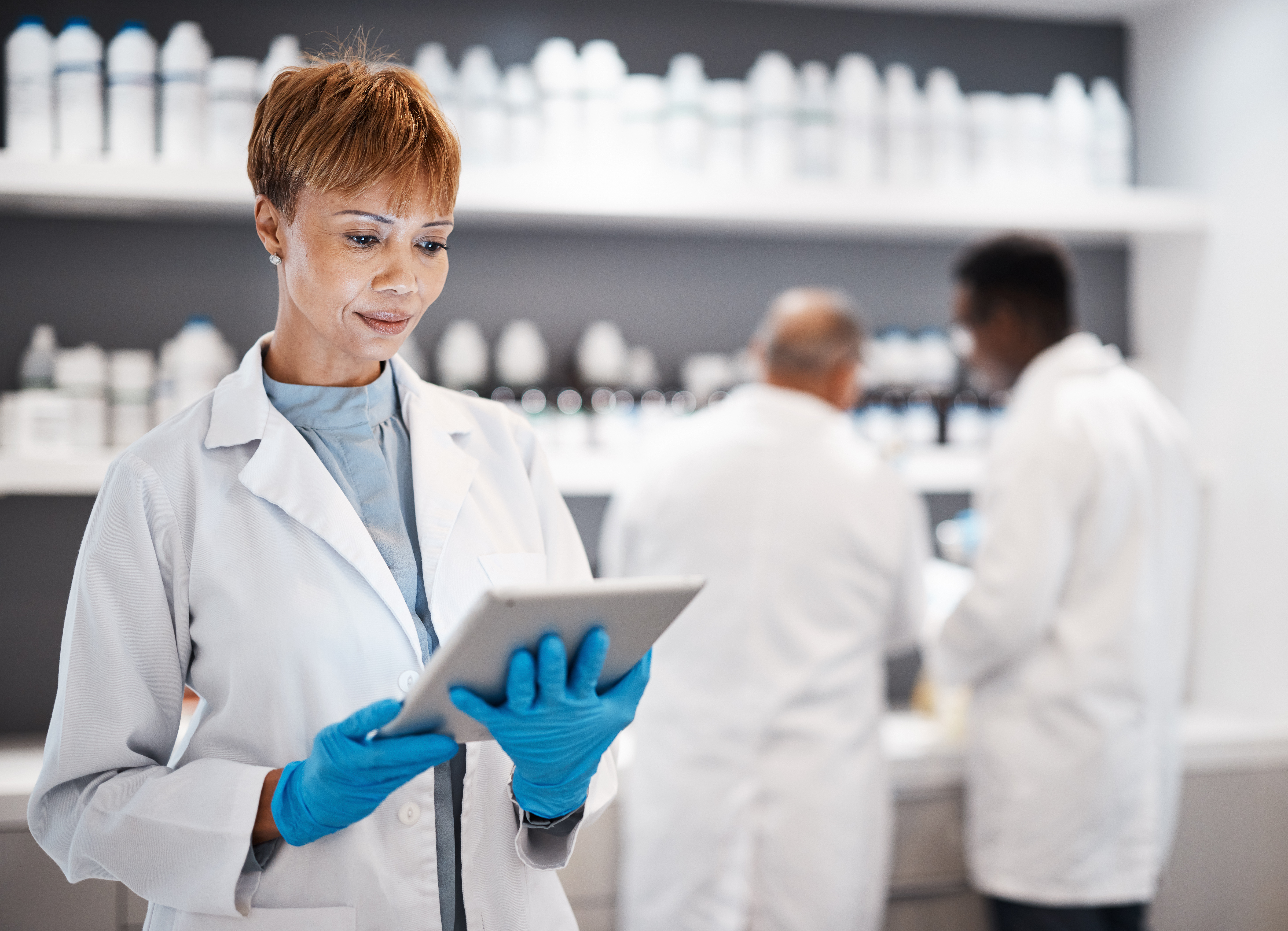 medical-science-tablet-and-doctor-woman-in-labora-2023-11-27-04-51-39-utc